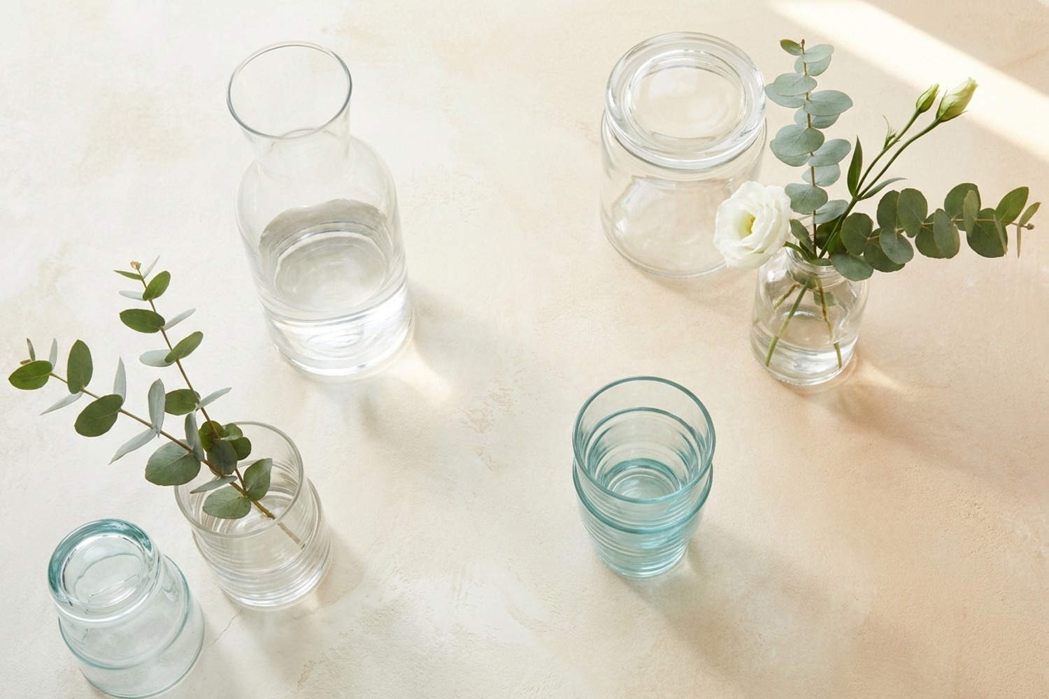 A flat-lay of clear glassware